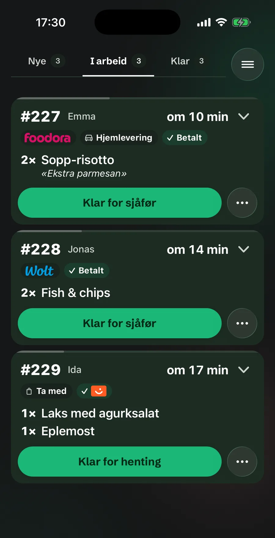 The kitchen screen on iPhone in dark mode, the In progress column: Foodora delivery 227, Wolt order 228 and takeaway order 229 paid with Vipps.